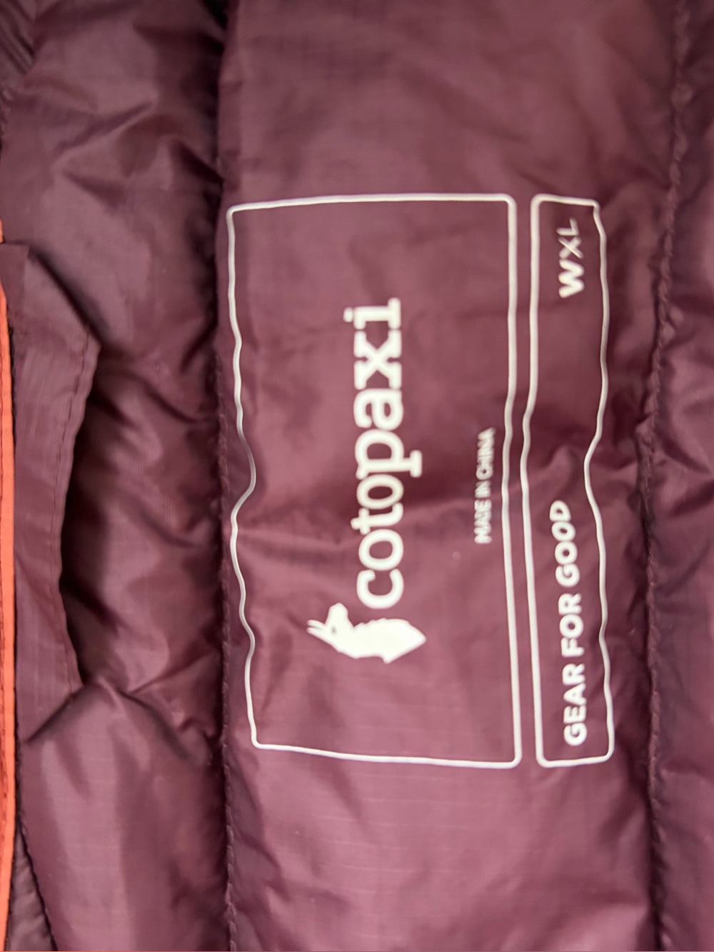 cotopaxi Rust Quilted Puffer Vest with Colorblock Chest Stripes - Picture 3 of 3